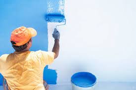 Professional painter applying interior wall paint in Magarpatta, Pune